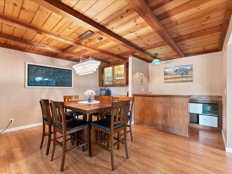 19907 Hidden Hills Road Cottonwood, CA 96022 - Photo 5 of 20 a view of a dining room with furniture and wooden floor