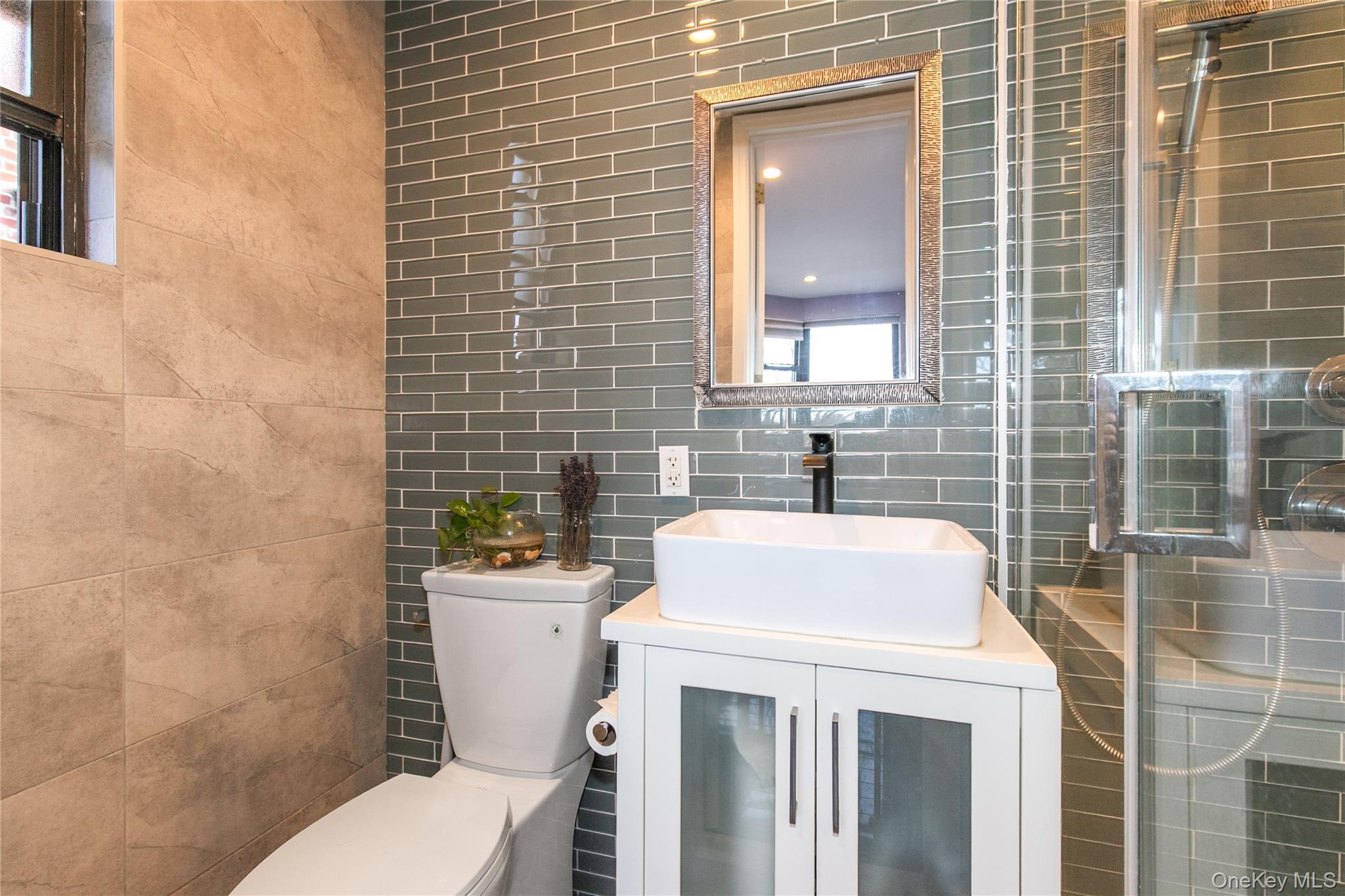 90 Schenck Avenue, Unit 3P Great Neck, NY 11021 - Photo 17 of 24 a bathroom with a sink a toilet and shower