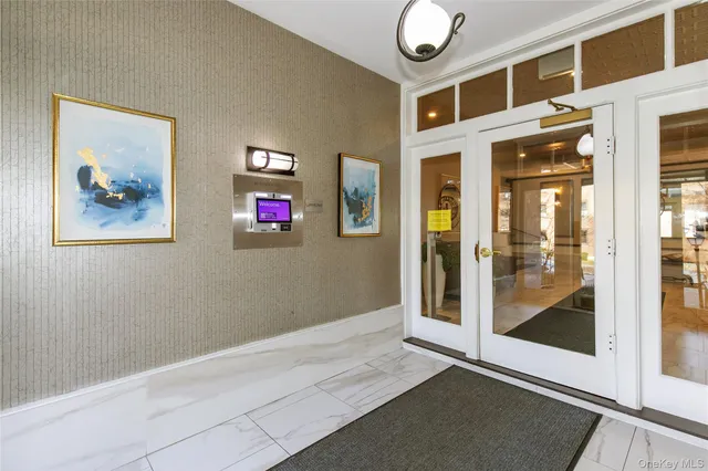 a view of an entryway with wooden floor