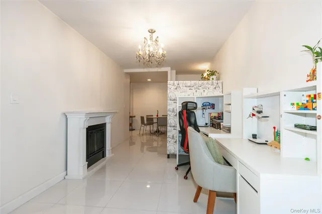 a living room with dining table and stainless steel appliances