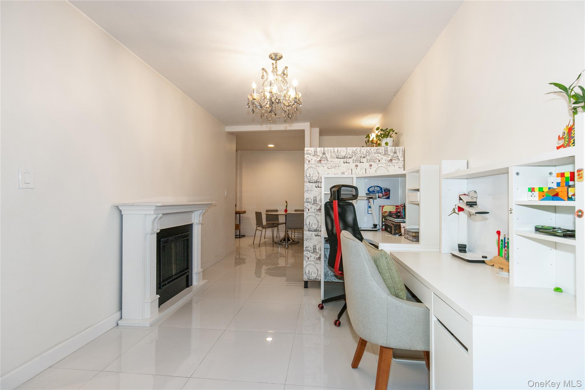 90 Schenck Avenue, Unit 3P Great Neck, NY 11021 - Photo 10 of 24 a view of a livingroom with furniture and a fireplace