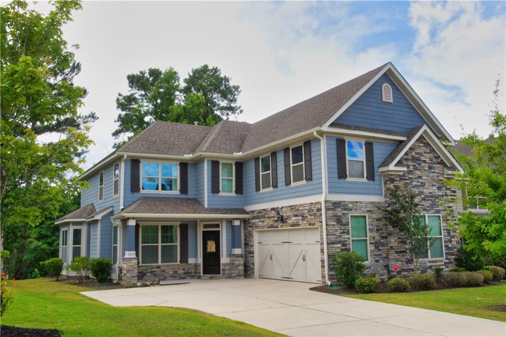 5639 Sunbury Loop Evans, GA 30809 - Photo 1 of 22 a front view of a house with garden
