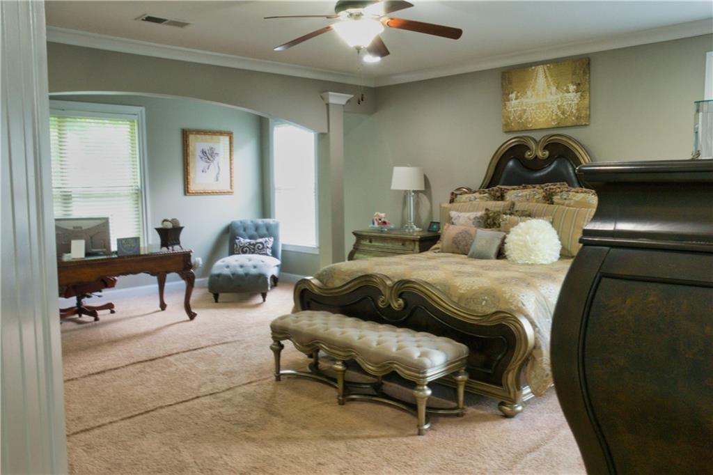 5639 Sunbury Loop Evans, GA 30809 - Photo 11 of 22 a bedroom with a bed and wooden floor
