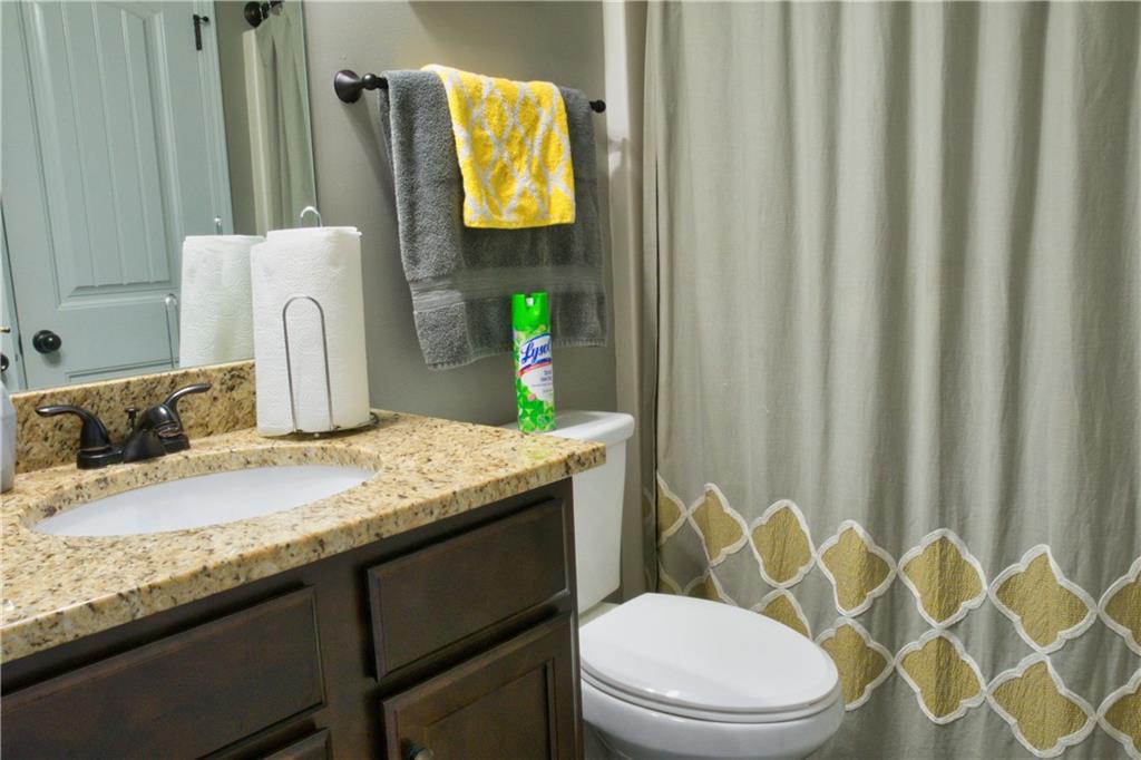 5639 Sunbury Loop Evans, GA 30809 - Photo 17 of 22 a bathroom with a granite countertop sink and a mirror