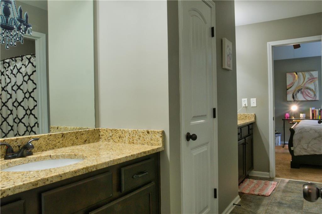 5639 Sunbury Loop Evans, GA 30809 - Photo 19 of 22 a bathroom with a granite countertop sink and a mirror