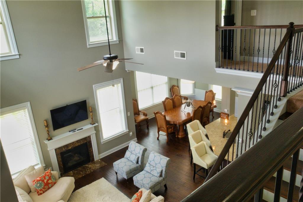 5639 Sunbury Loop Evans, GA 30809 - Photo 7 of 22 a living room with furniture a flat screen tv and a fireplace