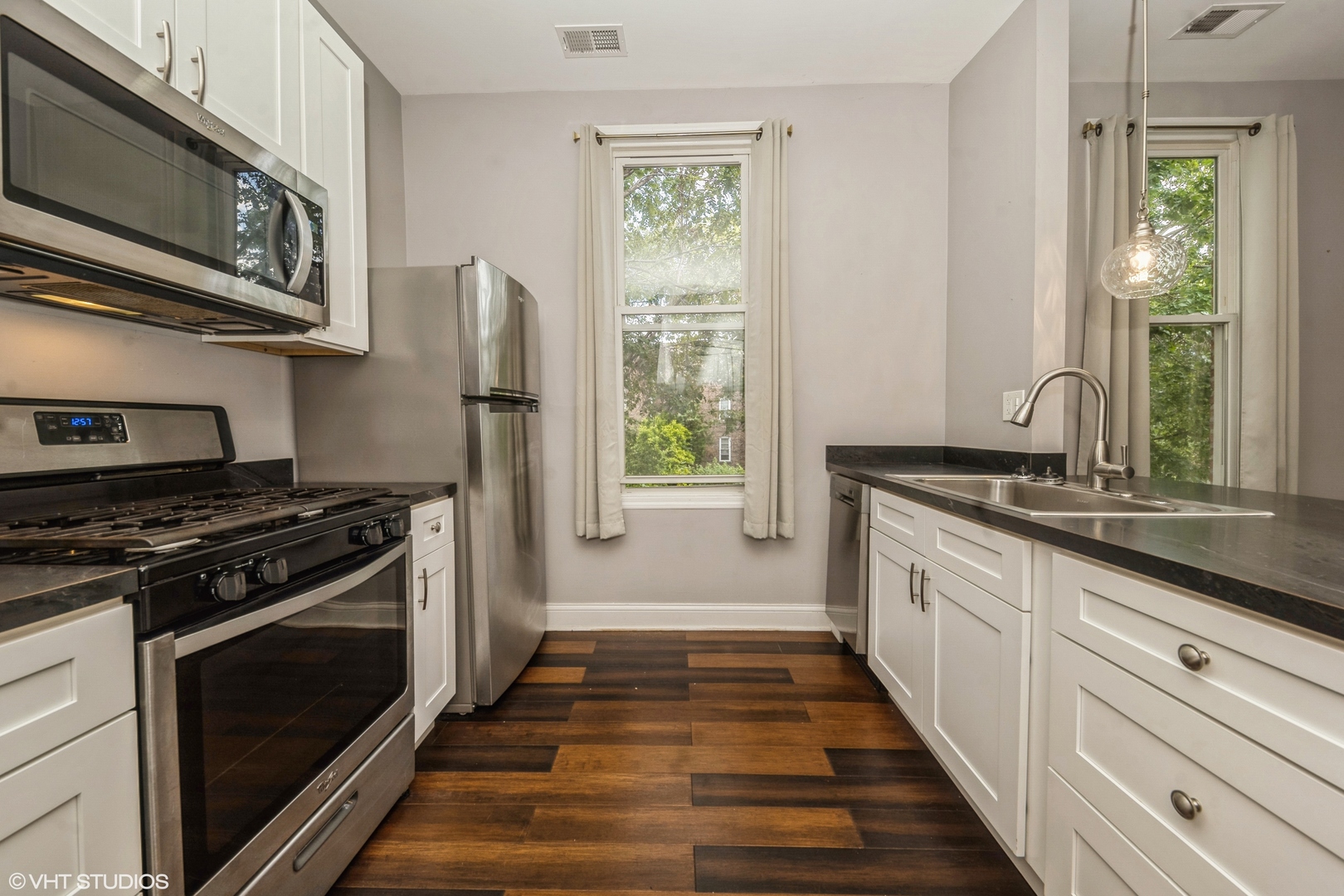 2734 West 18th Street, Unit 2R Chicago, IL 60608 - Photo 5 of 10 a kitchen with a stove oven and sink
