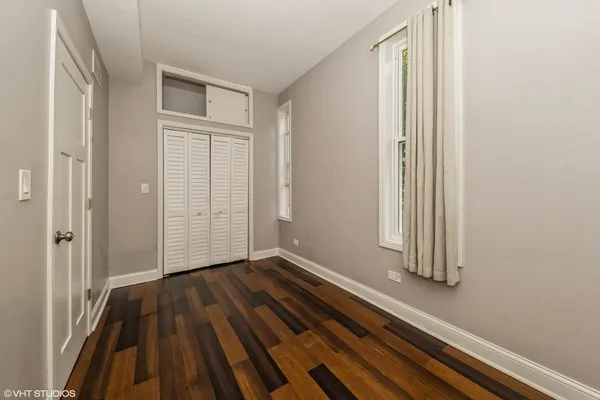 a view of a room with wooden floor and stairs