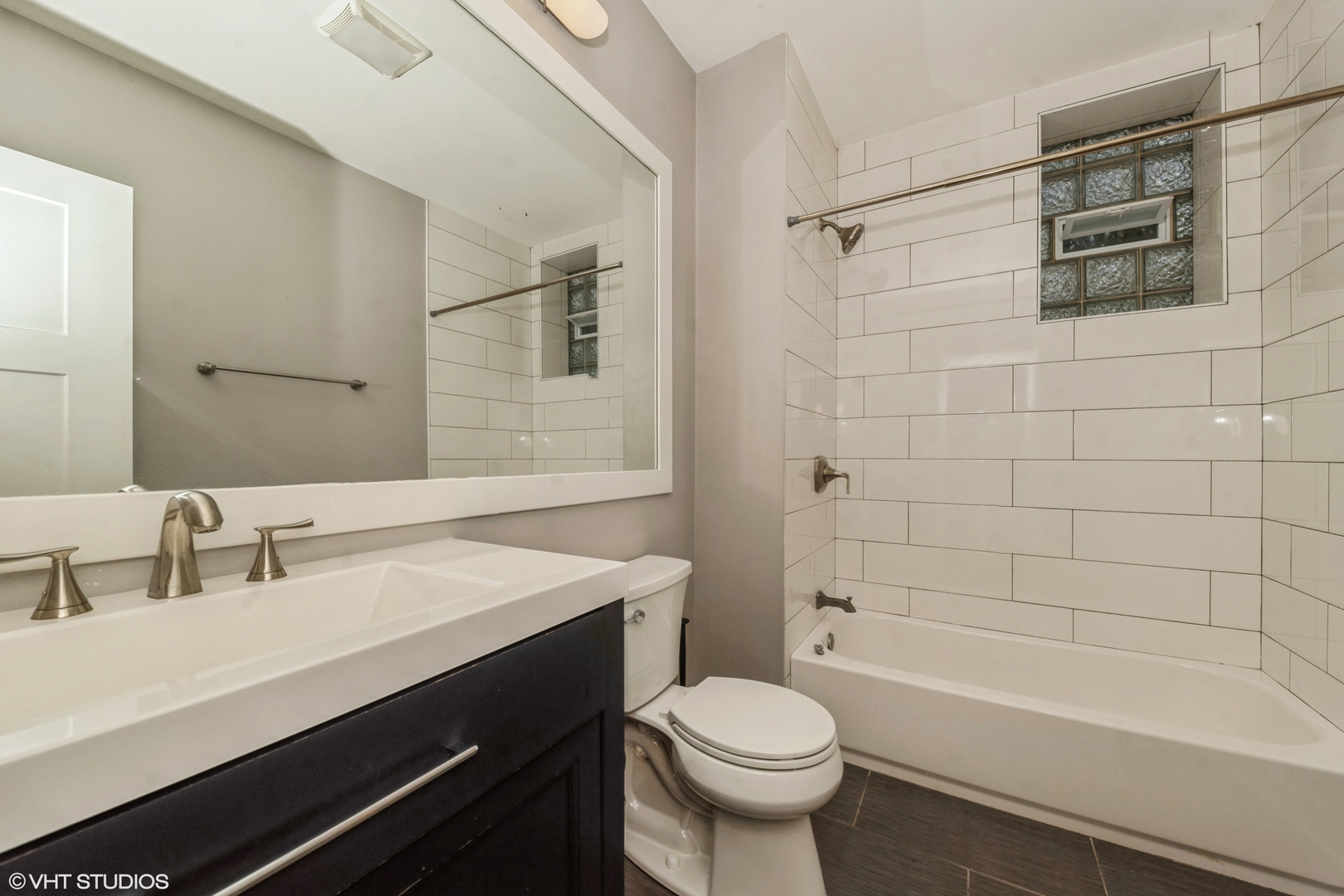2734 West 18th Street, Unit 2R Chicago, IL 60608 - Photo 10 of 10 a bathroom with a sink a toilet and shower