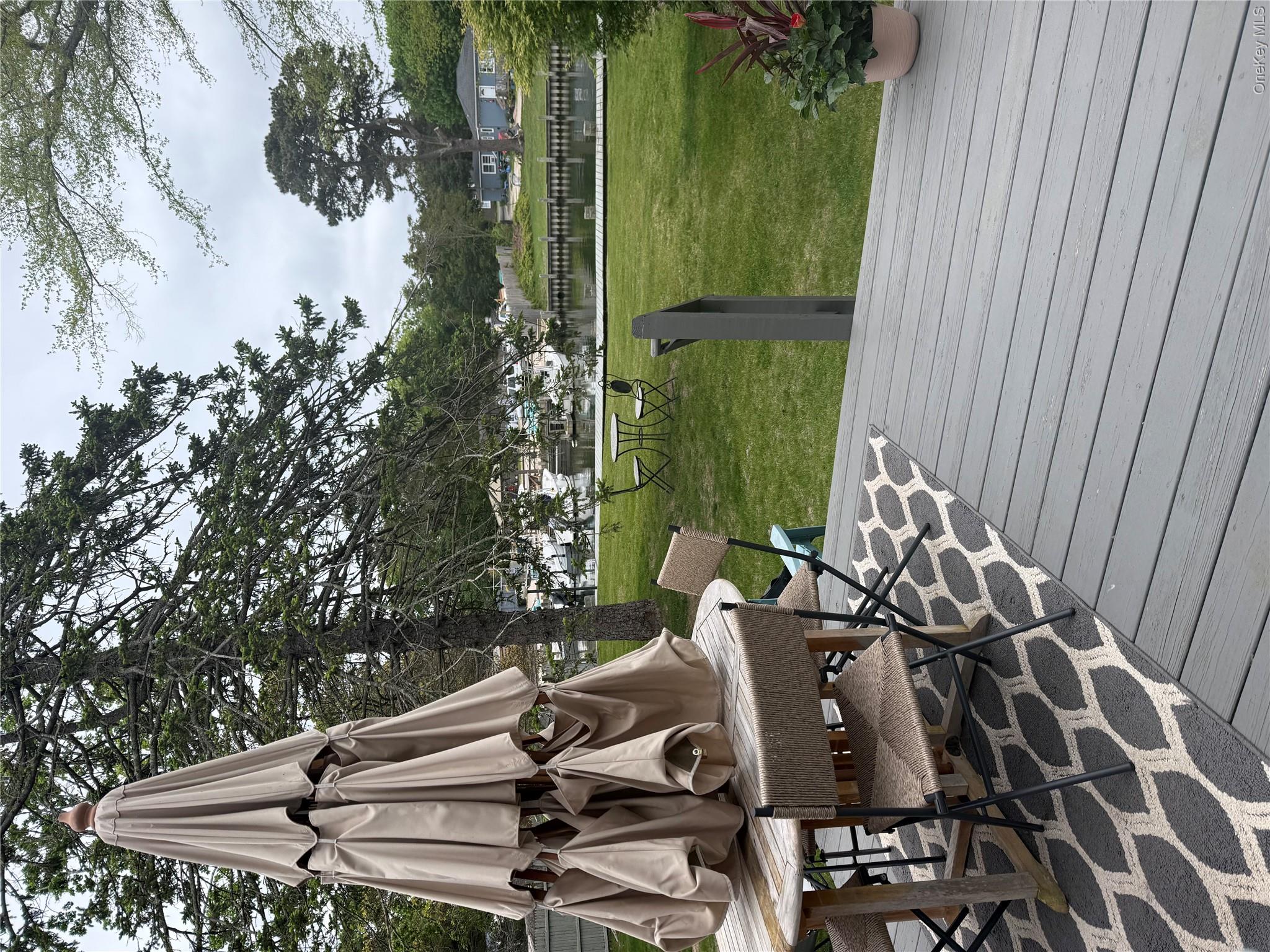 18 Shinnecock Road, Unit 3 Hampton Bays, NY 11946 - Photo 3 of 8 Private outdoor space for summer evenings