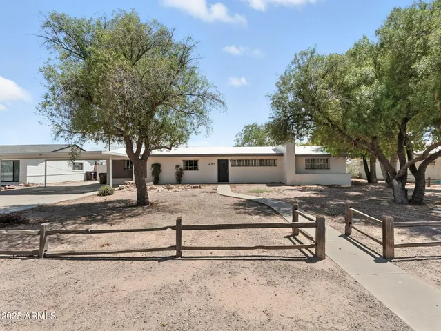 a view of a kitchen with cabinets and stainless steel appliances