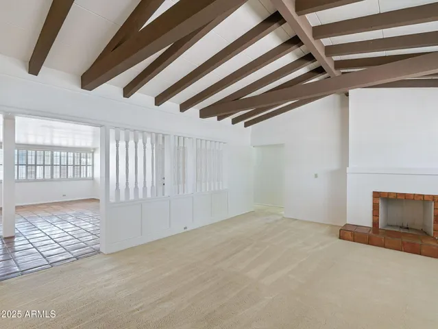 a bedroom with a bed and a potted plant