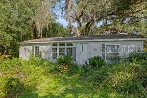 front view of a house with a garden