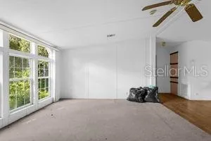 a big room with closet and a window