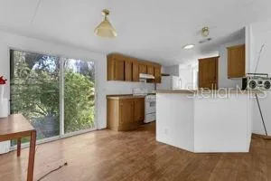 a view of kitchen with furniture and large window