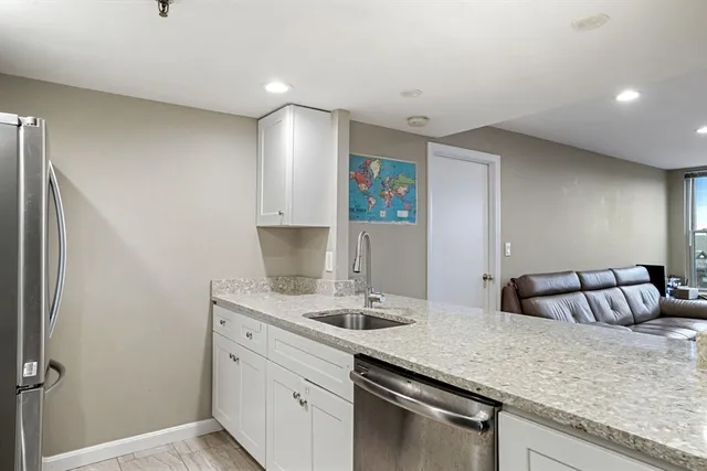 a kitchen with a sink and cabinets