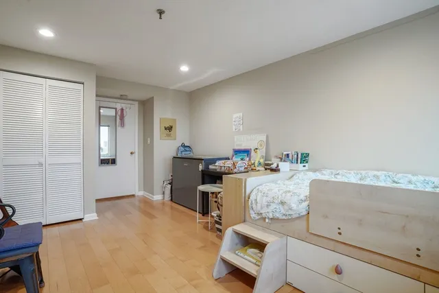 a bed room with a bed and furniture