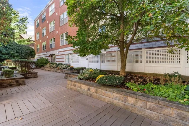 a couple of cars parked in front of a house