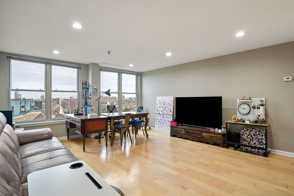 20 Webster Street, Unit 605 Brookline, MA 02446 - Photo 7 of 40 a living room with furniture and a flat screen tv