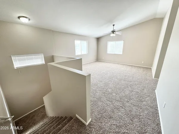 a view of an empty room with a window