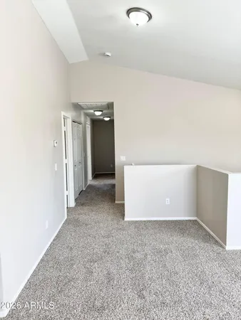 a bathroom with a white toilet sitting next to a bathroom sink and a mirror