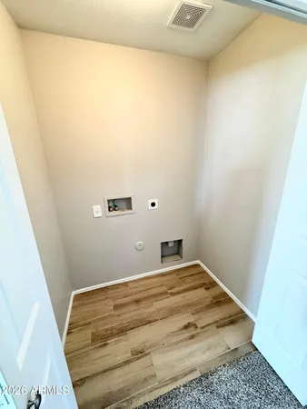 an entryway at an empty room with a window