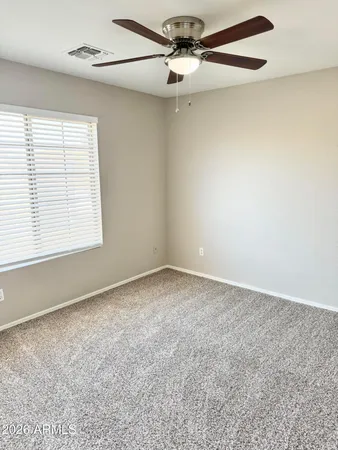 a view of a livingroom with a ceiling fan