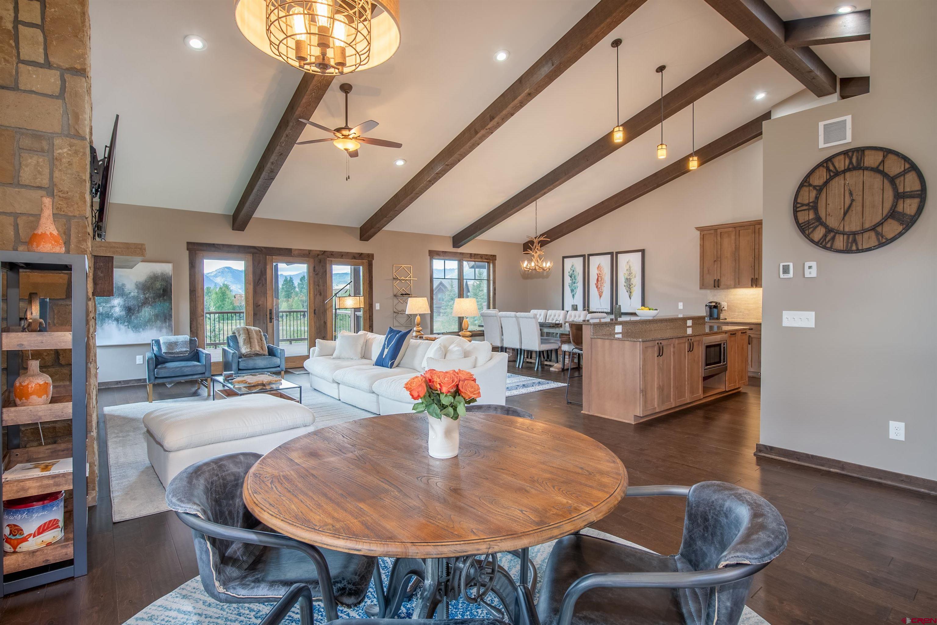 14 Ace Court Crested Butte, CO 81224 - Photo 3 of 24 a living room with furniture a chandelier fan and a rug