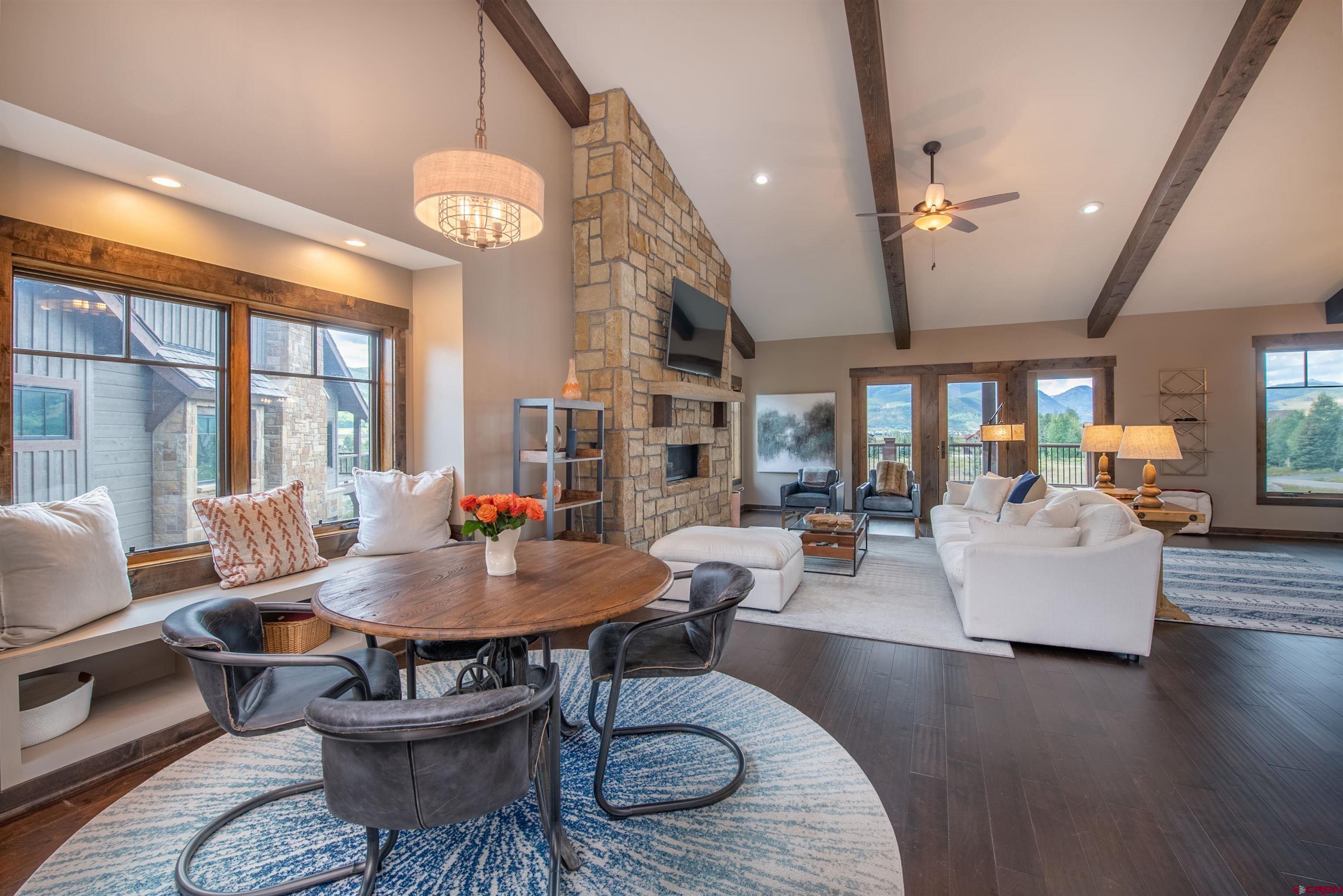 14 Ace Court Crested Butte, CO 81224 - Photo 4 of 24 a living room with fireplace furniture and a large window
