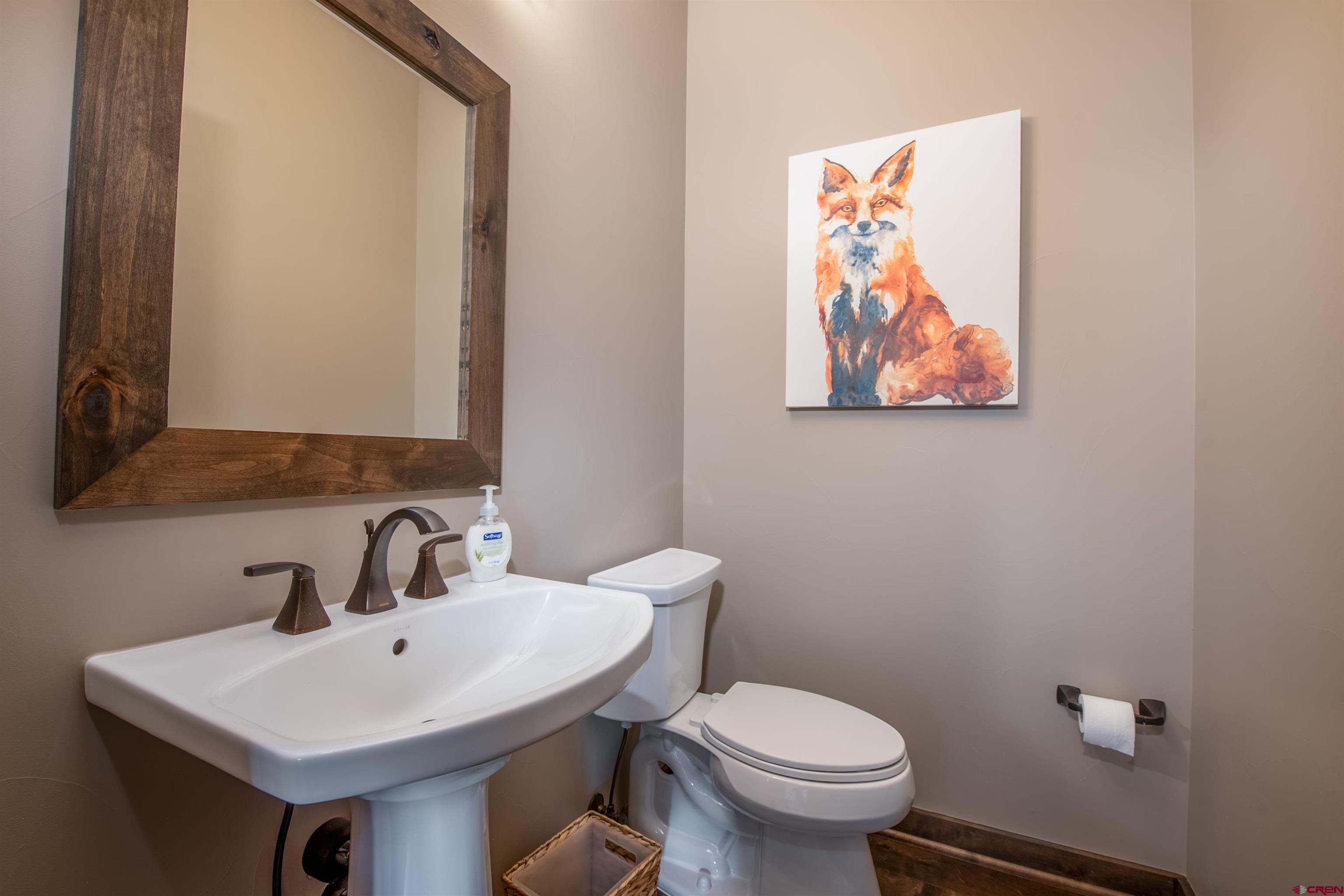 14 Ace Court Crested Butte, CO 81224 - Photo 9 of 24 a bathroom with a toilet a sink and mirror