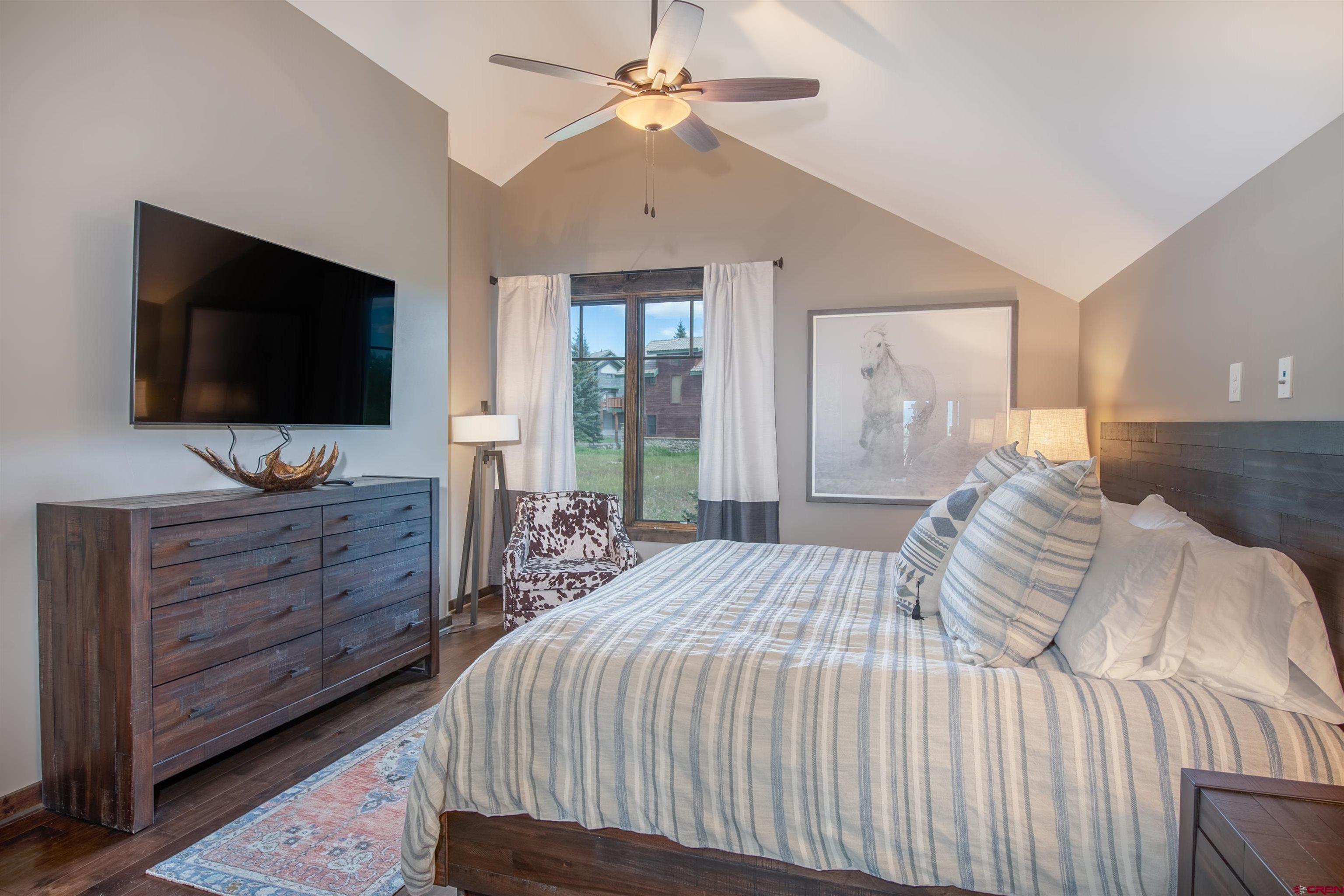 14 Ace Court Crested Butte, CO 81224 - Photo 10 of 24 a bedroom with a bed and a flat screen tv
