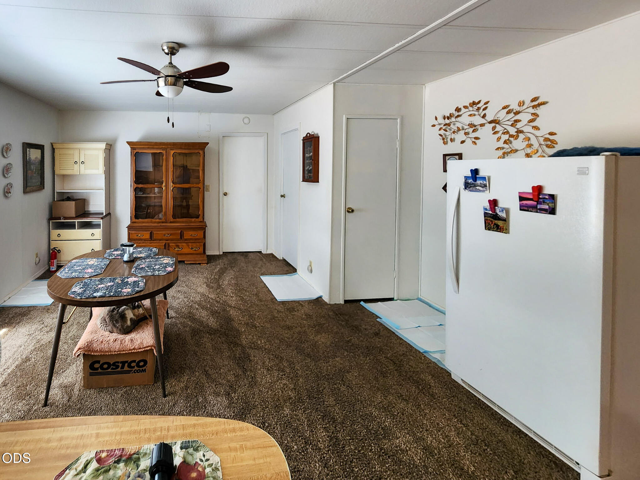 350 Hamilton Avenue Cave Junction, OR 97523 - Photo 14 of 34 a living room with furniture and a chandelier
