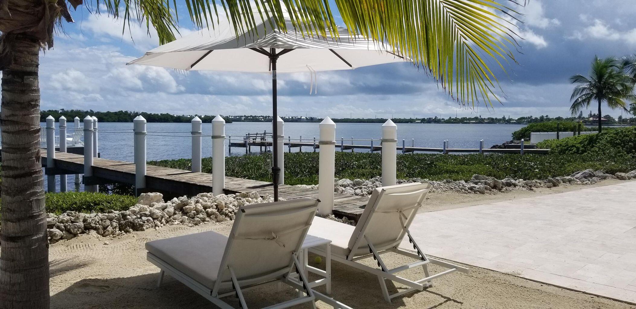 101 Windy Point Circle Marathon, FL 33050 - Photo 11 of 66 a view of a chairs and table in the patio