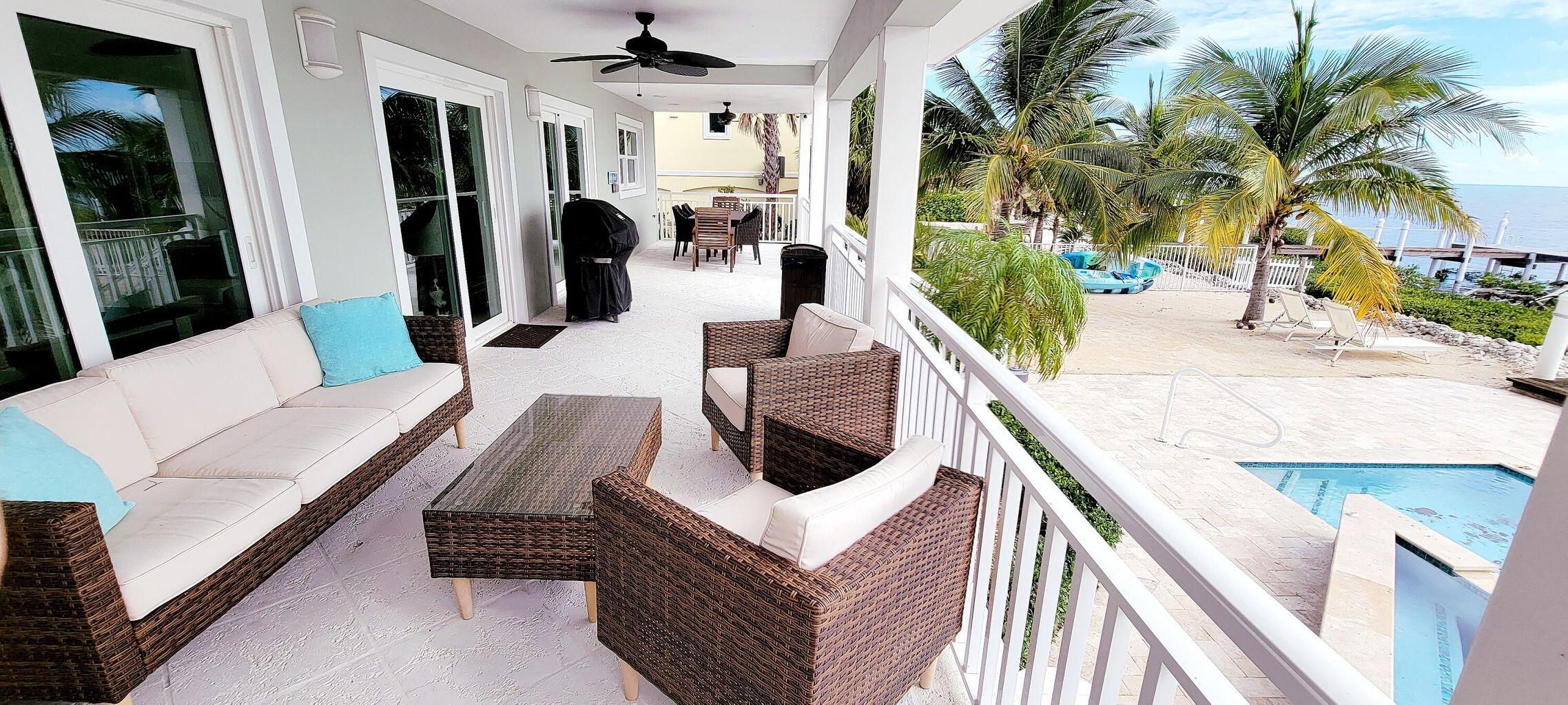 101 Windy Point Circle Marathon, FL 33050 - Photo 14 of 66 a living room with furniture and a couch
