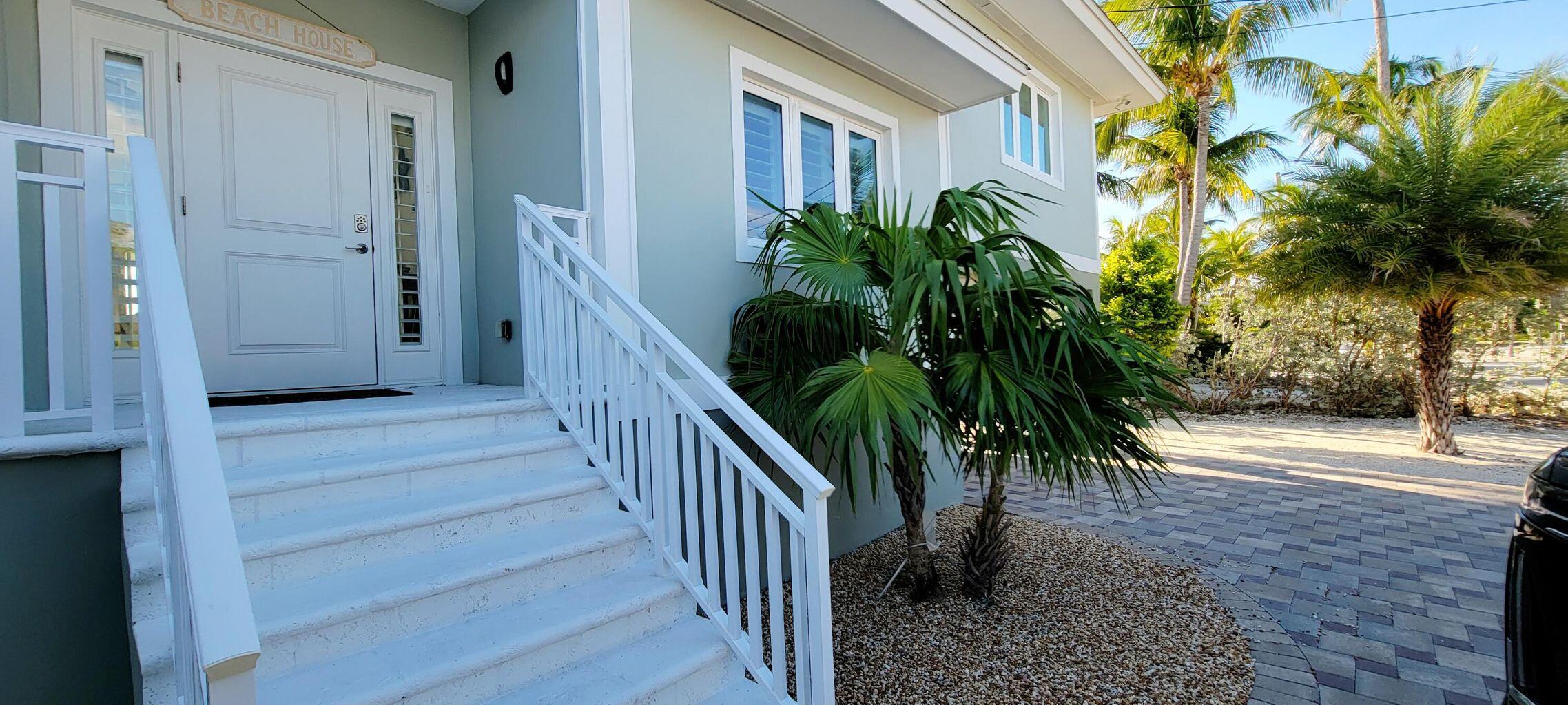 101 Windy Point Circle Marathon, FL 33050 - Photo 18 of 66 a view of a house with a yard