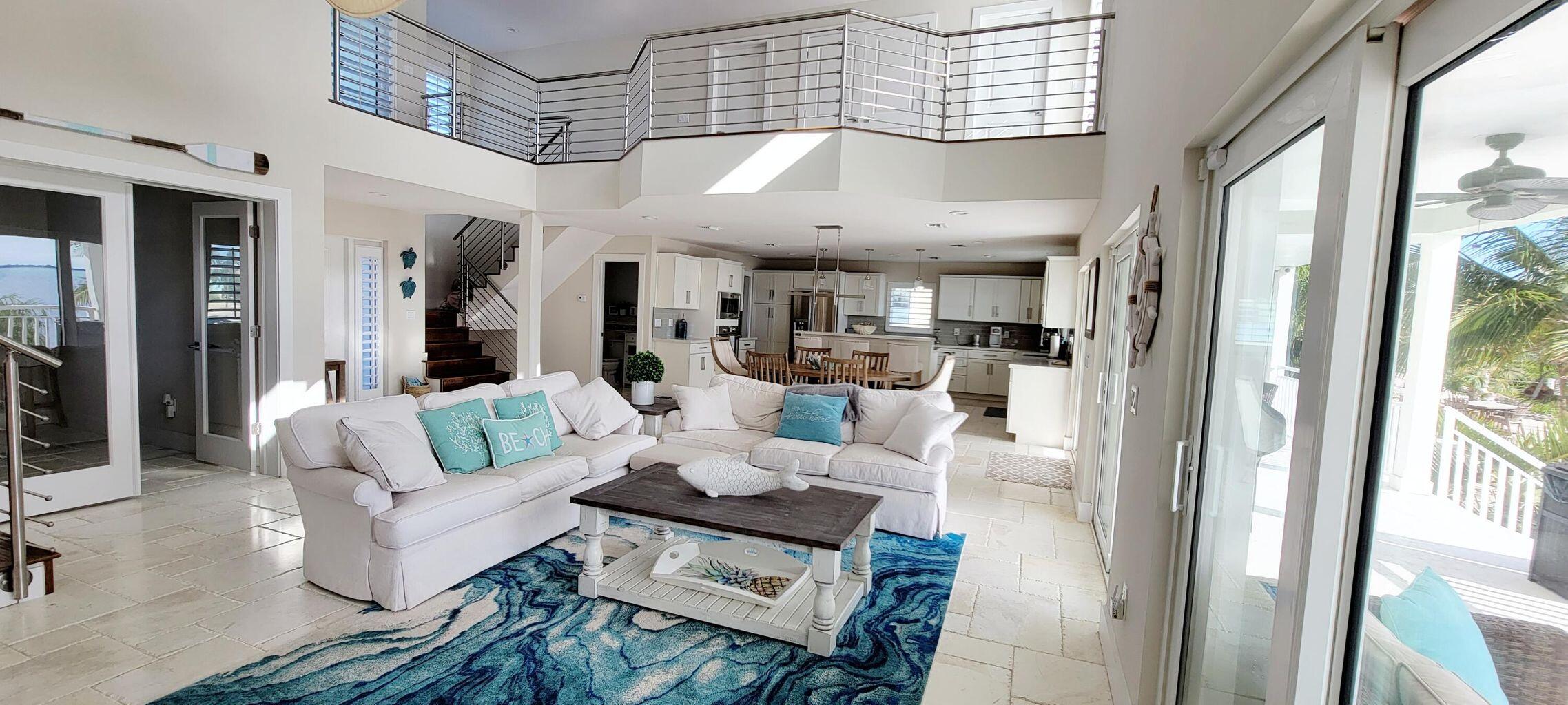 101 Windy Point Circle Marathon, FL 33050 - Photo 22 of 66 a living room with furniture and a chandelier