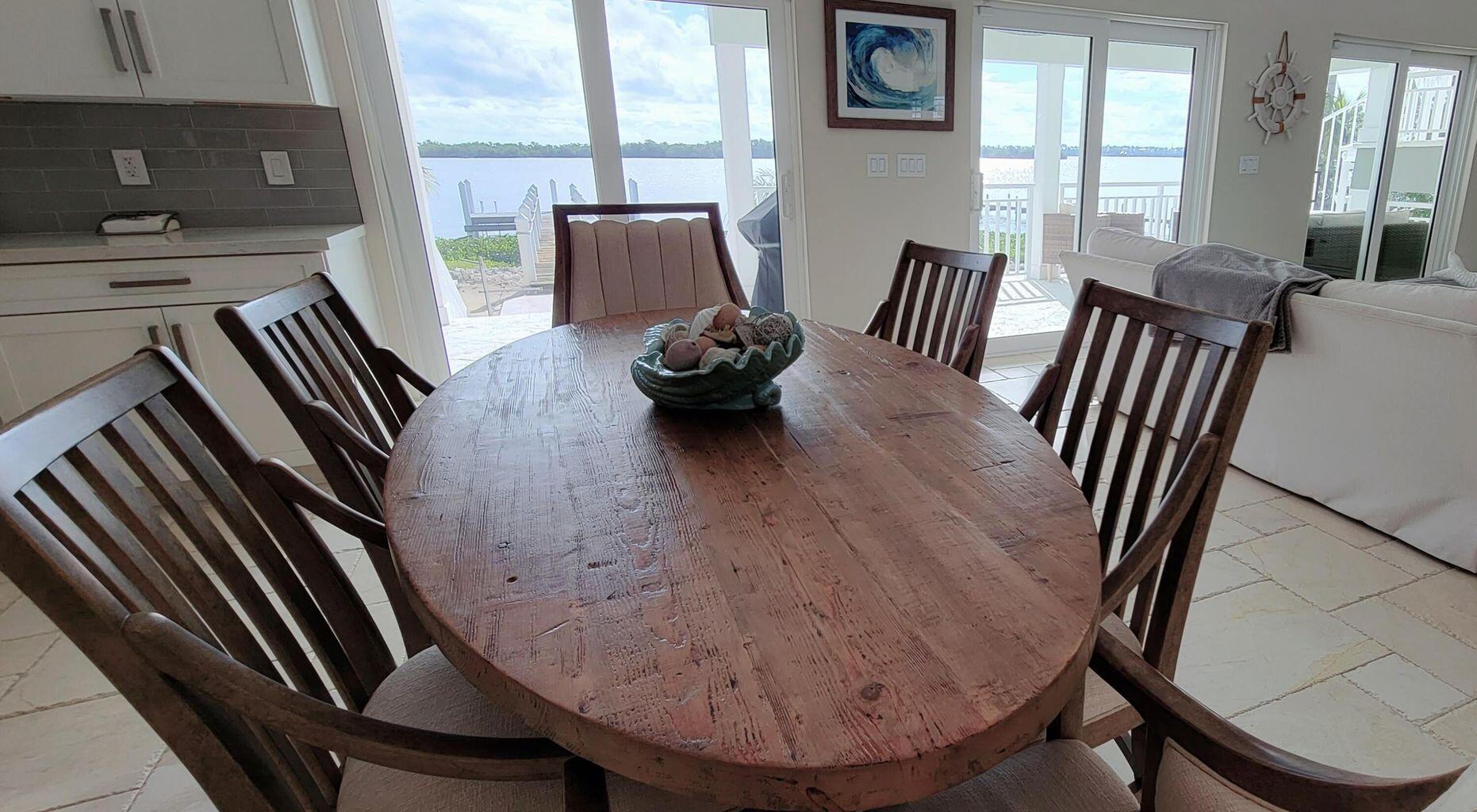 101 Windy Point Circle Marathon, FL 33050 - Photo 28 of 66 an outdoor living room with furniture and a floor to ceiling window
