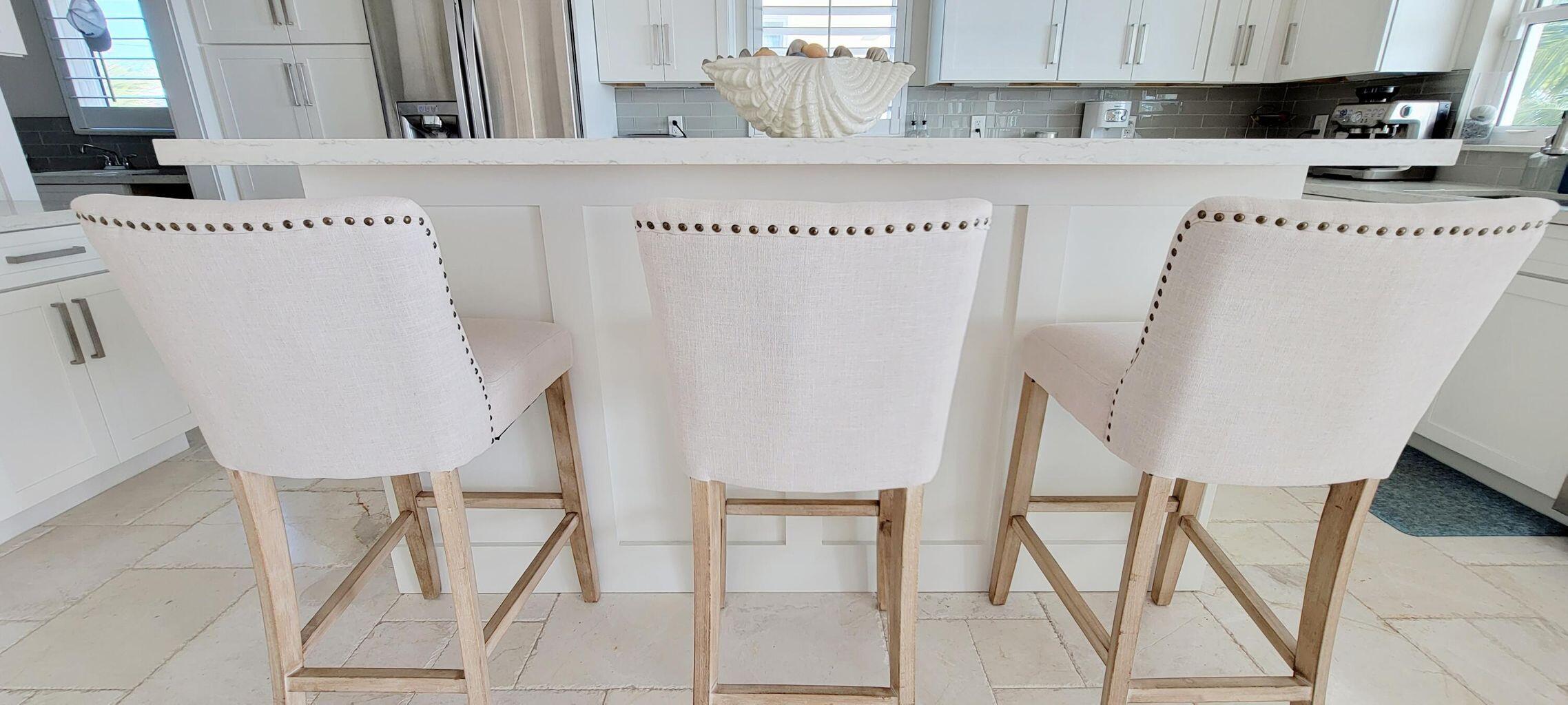 101 Windy Point Circle Marathon, FL 33050 - Photo 30 of 66 a kitchen with a white cabinets and chairs