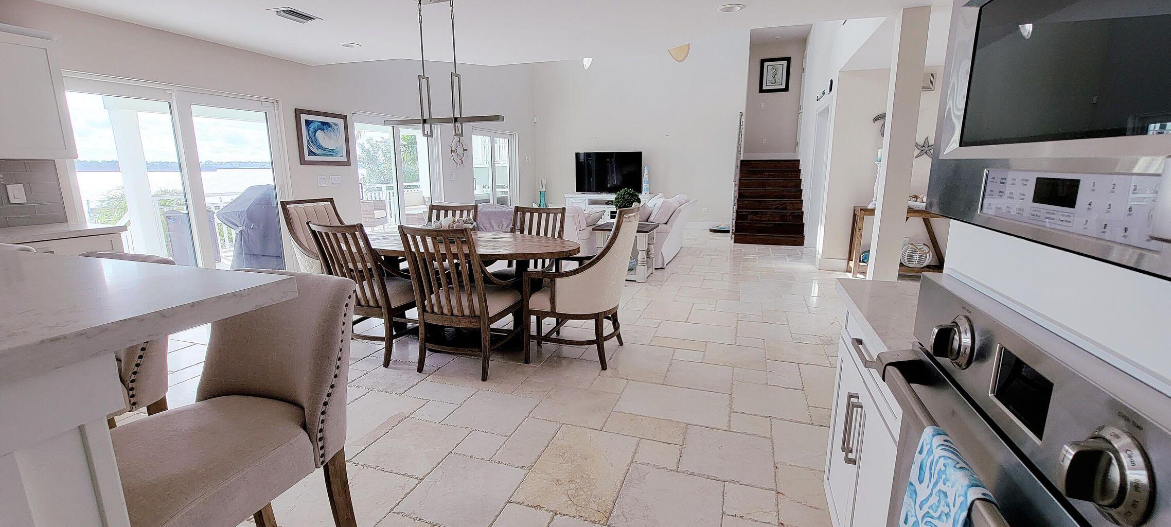 101 Windy Point Circle Marathon, FL 33050 - Photo 38 of 66 a view of a dining room with furniture window and wooden floor