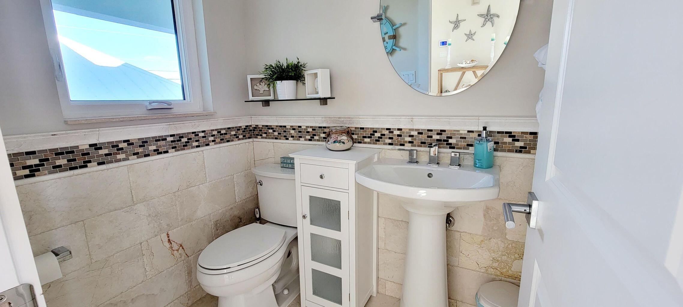 101 Windy Point Circle Marathon, FL 33050 - Photo 39 of 66 a bathroom with a toilet and a sink