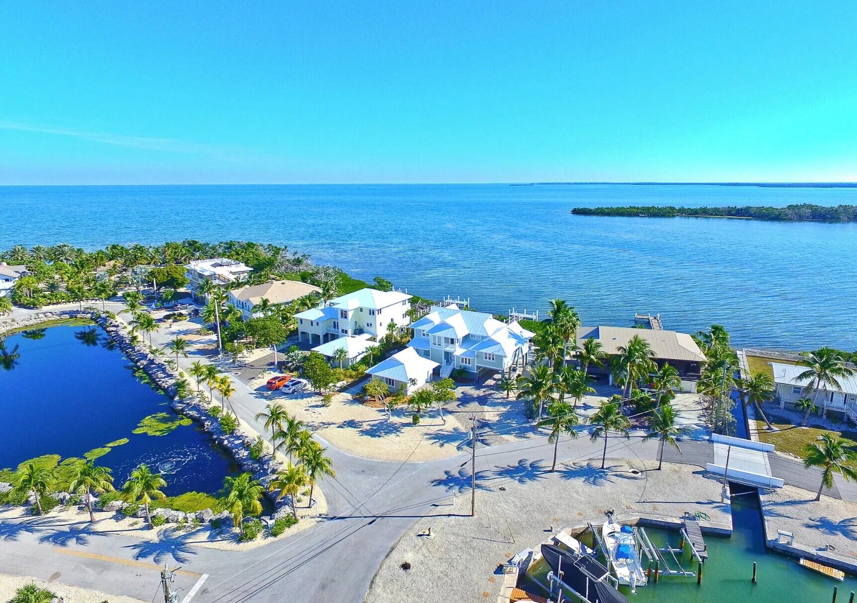 101 Windy Point Circle Marathon, FL 33050 - Photo 4 of 66 a view of a lake with a garden
