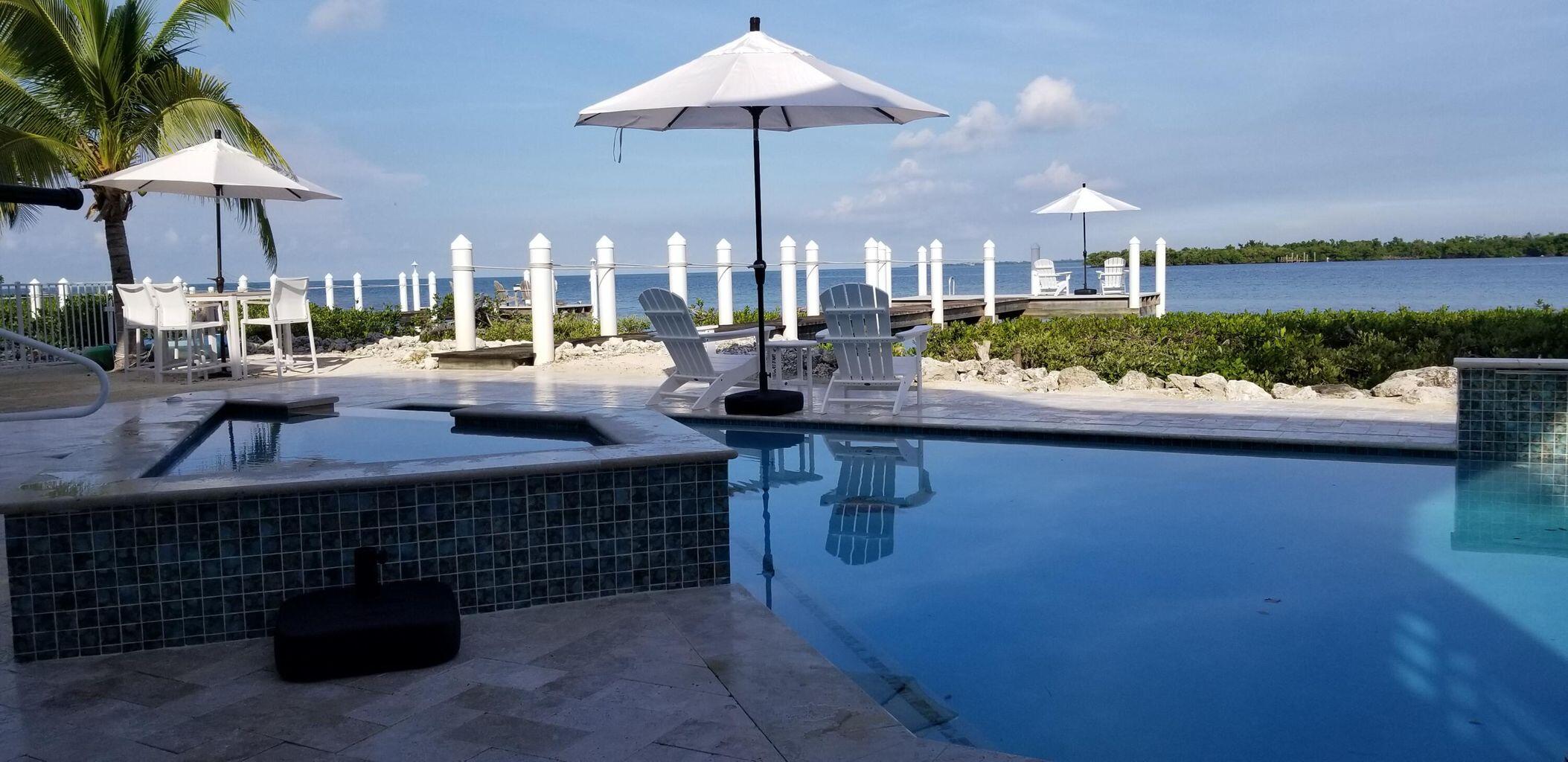 101 Windy Point Circle Marathon, FL 33050 - Photo 5 of 66 a outdoor living space with furniture and a garden