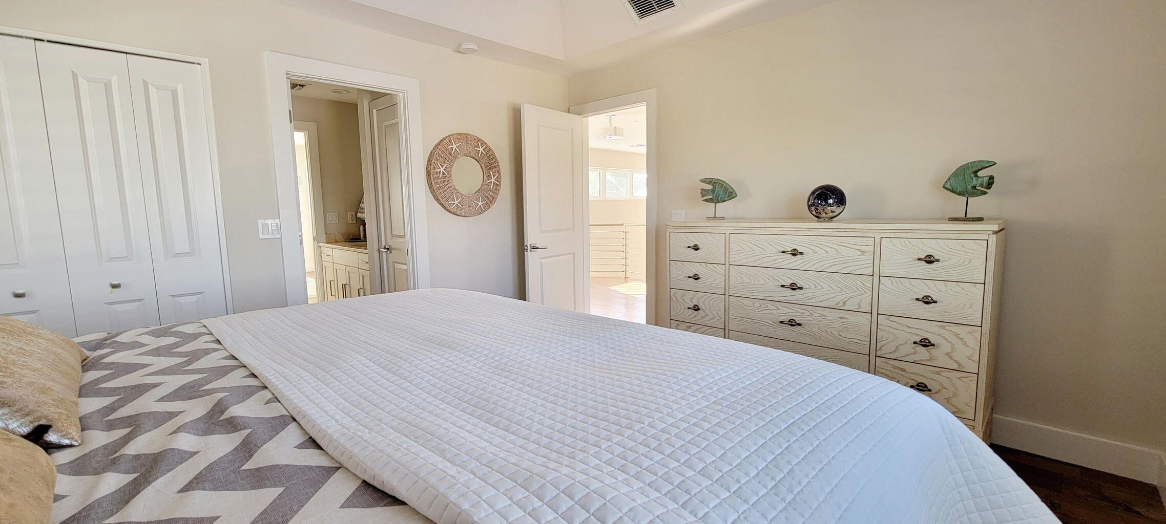 101 Windy Point Circle Marathon, FL 33050 - Photo 54 of 66 a bedroom with a bed and a closet