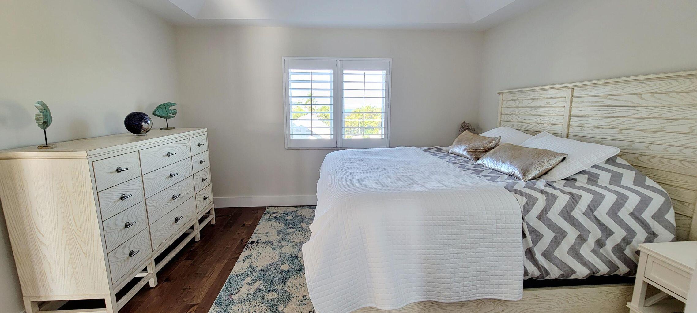 101 Windy Point Circle Marathon, FL 33050 - Photo 55 of 66 a bedroom with a bed and a window