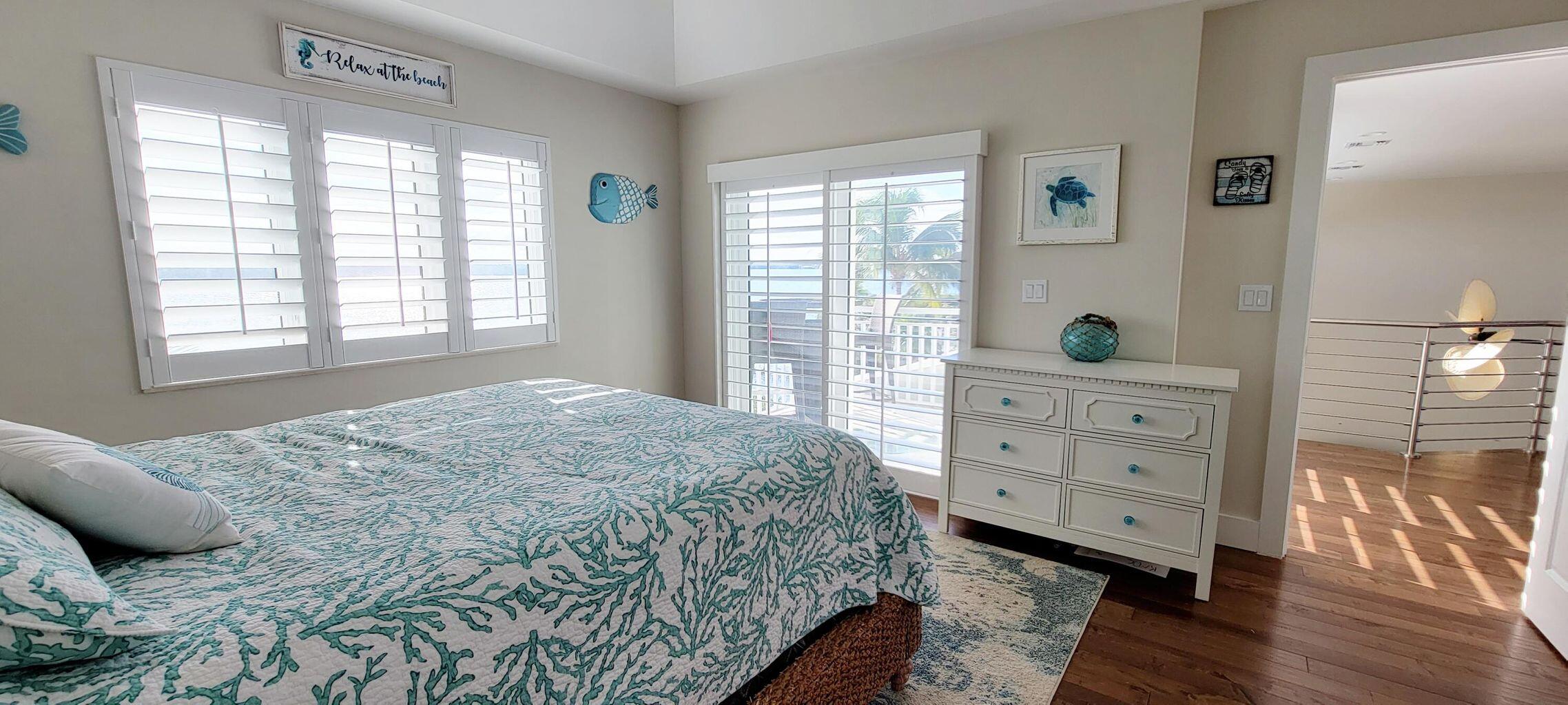 101 Windy Point Circle Marathon, FL 33050 - Photo 57 of 66 a bedroom with a bed and a window