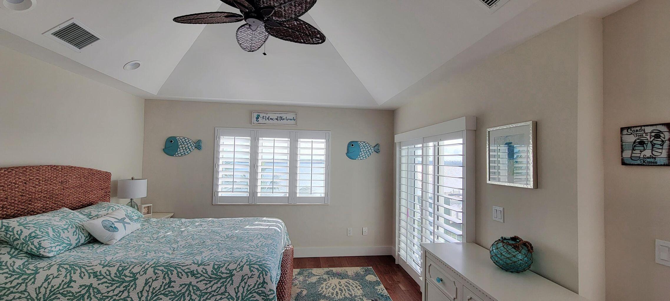 101 Windy Point Circle Marathon, FL 33050 - Photo 58 of 66 a bedroom with a bed and a window