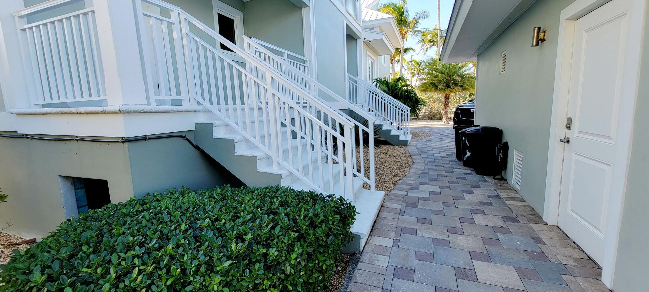 101 Windy Point Circle Marathon, FL 33050 - Photo 61 of 66 a view of a pathway of the house with flower plants