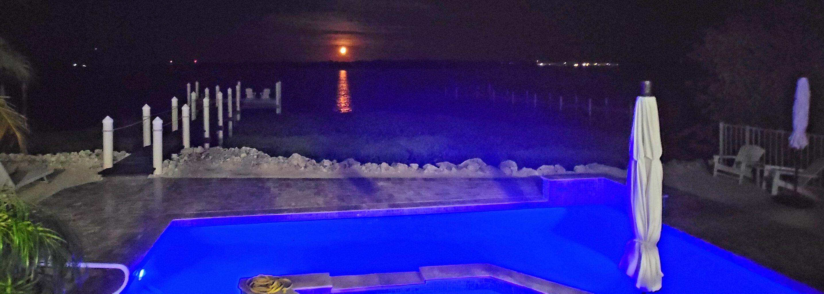 101 Windy Point Circle Marathon, FL 33050 - Photo 64 of 66 a view of a room with a projector screen and couches