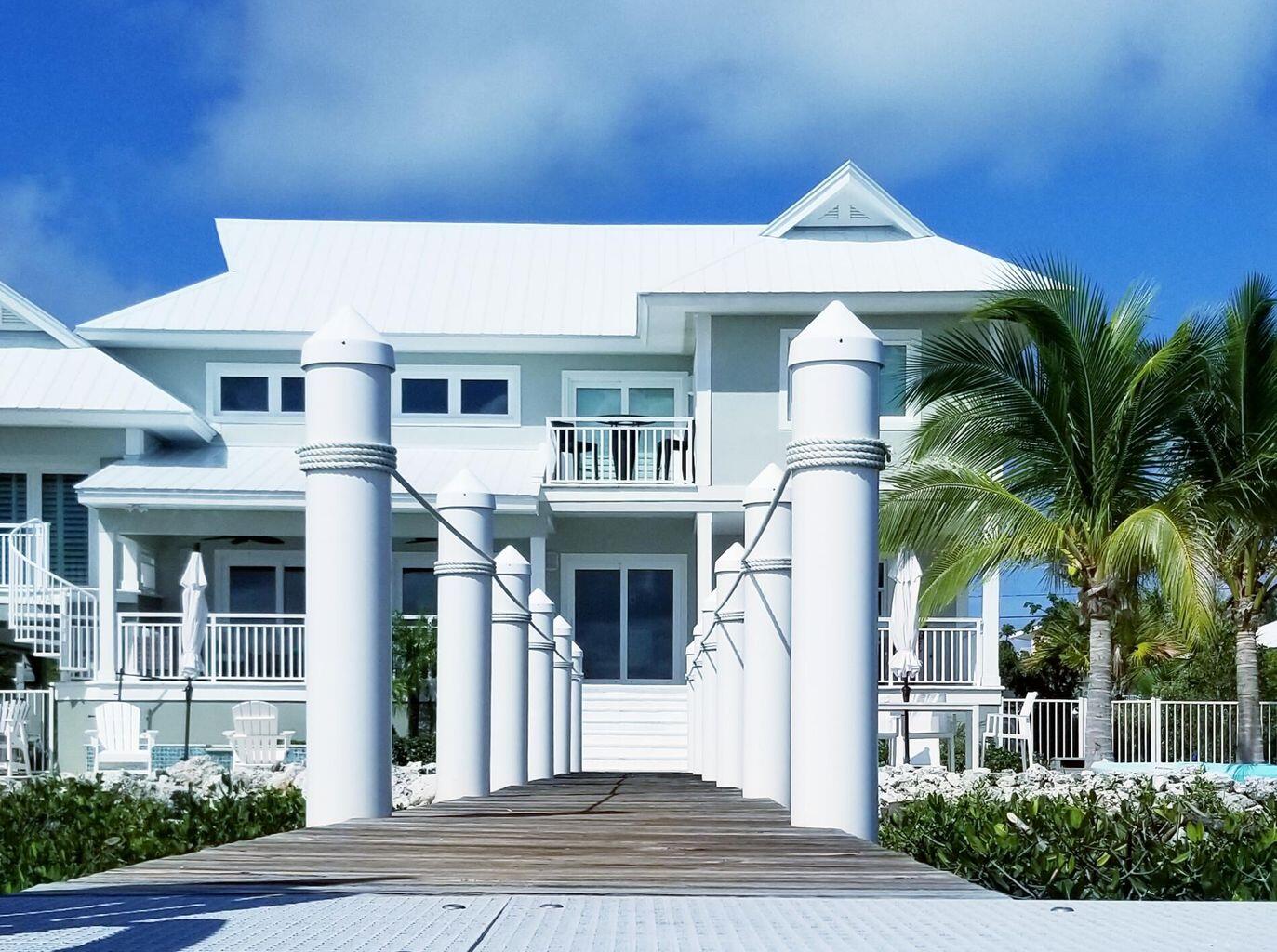 101 Windy Point Circle Marathon, FL 33050 - Photo 8 of 66 a front view of a house with a yard