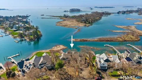 an aerial view of a house with a lake view